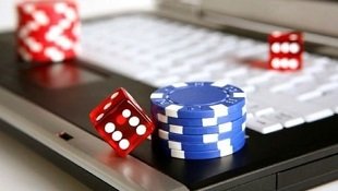 Live dealer dealing cards in No Commission Baccarat studio